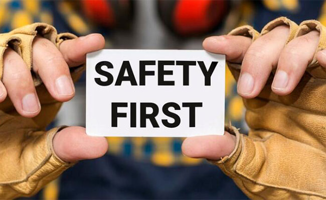 Safety first card held in two hands
